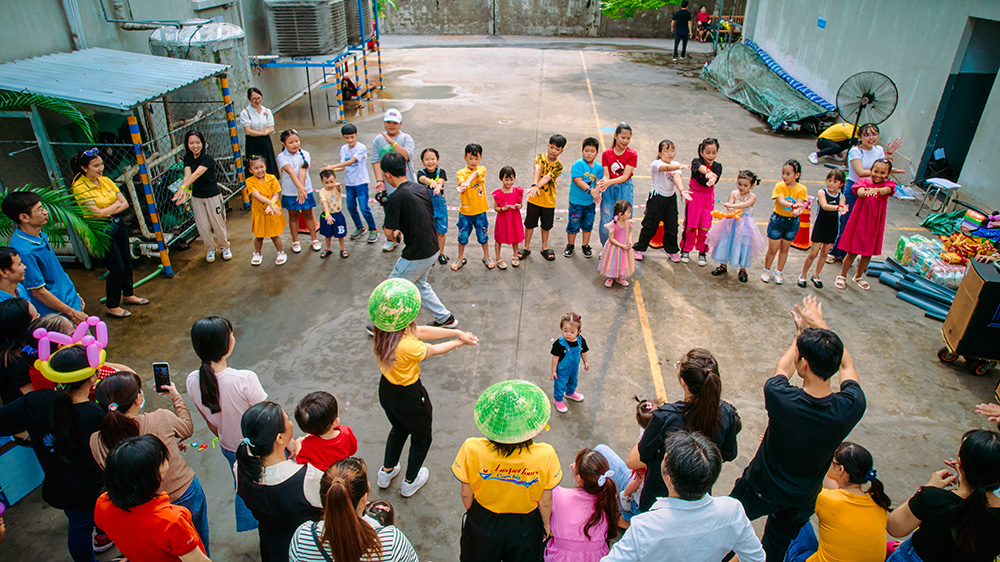 Parents and children have fun at a Family Day activity at a factory in Vietnam